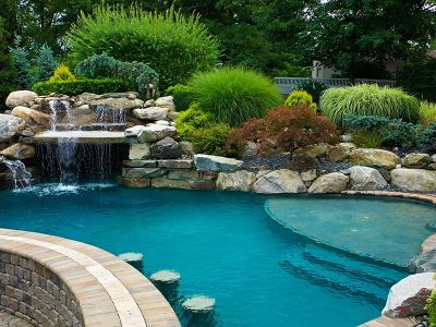 Luxury Pool Features: Integrating Waterfalls and Fire Pits