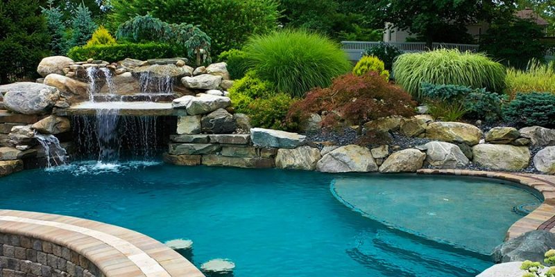 Luxury Pool Features: Integrating Waterfalls and Fire Pits